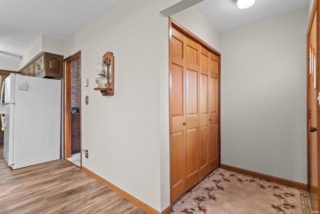 hallway featuring light hardwood / wood-style flooring