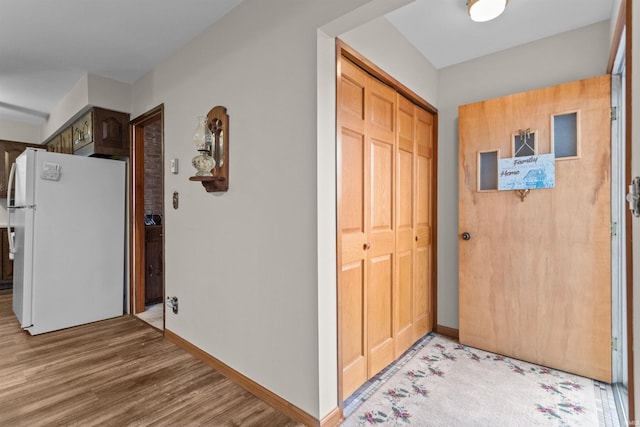 foyer entrance featuring hardwood / wood-style floors