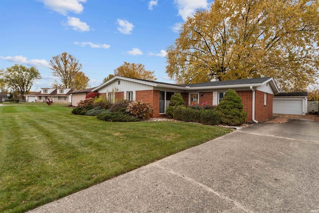 single story home featuring a garage and a front yard