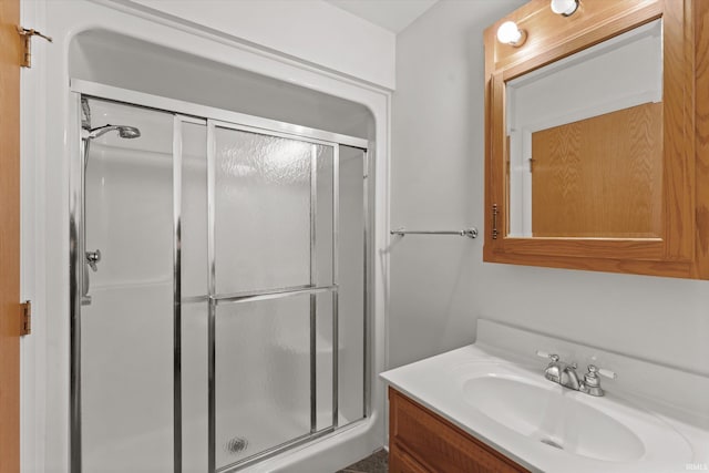 bathroom with vanity and walk in shower