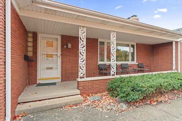 property entrance featuring covered porch