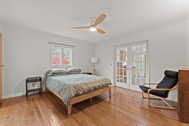 bedroom with french doors, ceiling fan, crown molding, and hardwood / wood-style floors