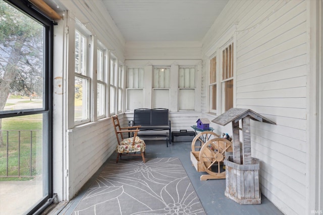 sunroom / solarium featuring a healthy amount of sunlight