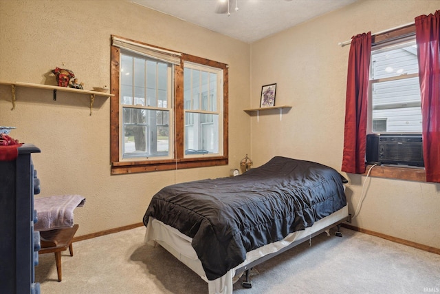 carpeted bedroom with cooling unit and ceiling fan