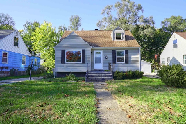 new england style home with a front yard