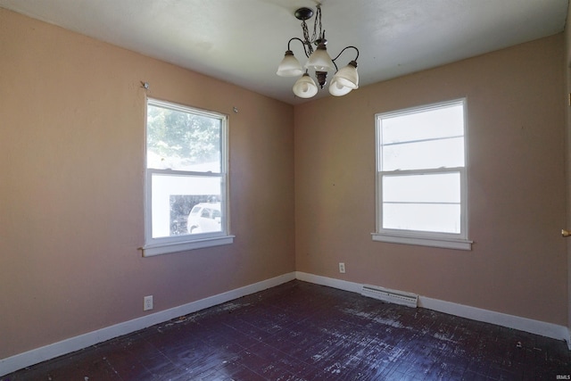 empty room featuring an inviting chandelier and plenty of natural light