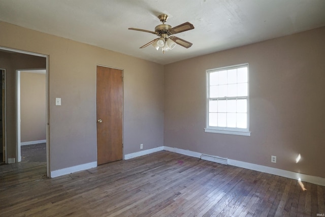 spare room featuring hardwood / wood-style flooring and ceiling fan