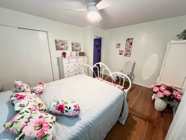 bedroom featuring a closet, ceiling fan, and dark wood-type flooring