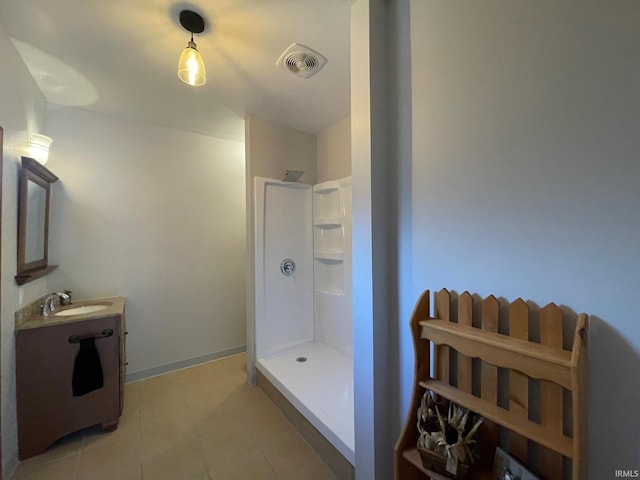 bathroom with vanity and a shower