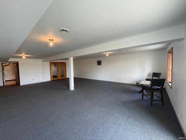 basement with dark colored carpet