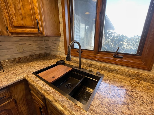 details featuring sink and backsplash