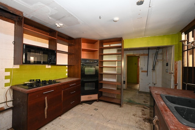 kitchen featuring sink and black appliances