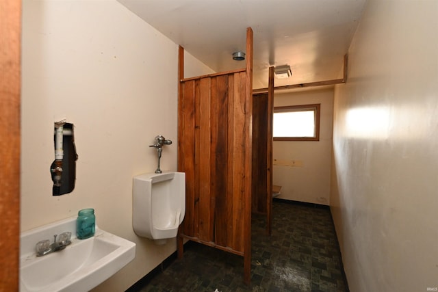 bathroom featuring toilet and sink