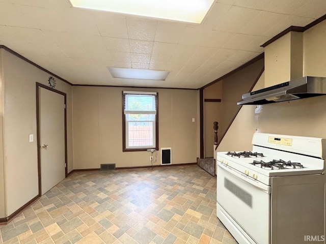 kitchen with wall chimney exhaust hood and white range with gas cooktop