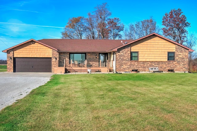 ranch-style house with a porch, a front yard, and a garage