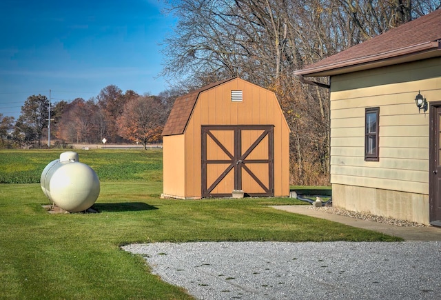 view of outbuilding featuring a yard