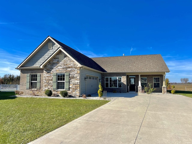 1793 Breckenridge Pass, Fort Wayne, IN 46845 - craftsman-style home with concrete driveway, an attached garage, stone siding, and a front lawn