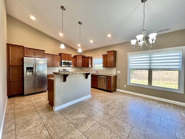 1793 Breckenridge Pass, Fort Wayne, IN 46845 - kitchen with visible vents, a kitchen breakfast bar, backsplash, and stainless steel appliances