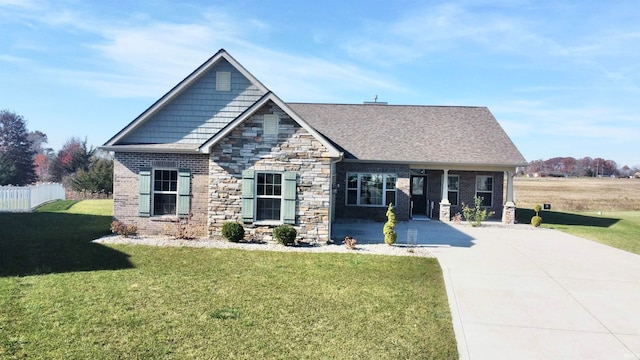 craftsman house featuring a front lawn