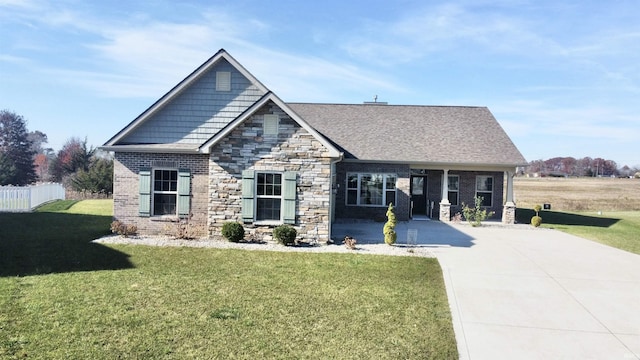 1793 Breckenridge Pass, Fort Wayne, IN 46845 - craftsman-style home with fence, brick siding, a front lawn, and stone siding