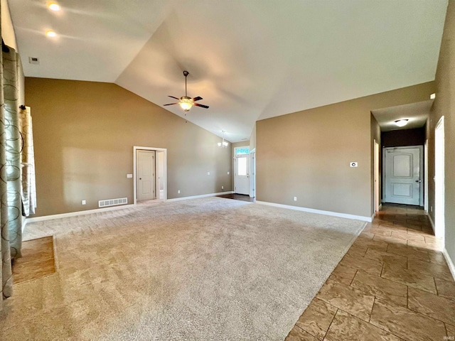 unfurnished living room with light colored carpet, high vaulted ceiling, and ceiling fan