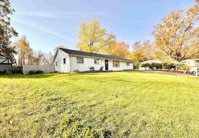 rear view of house with a lawn