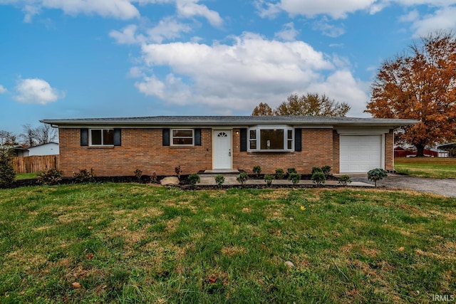 single story home with a front lawn and a garage