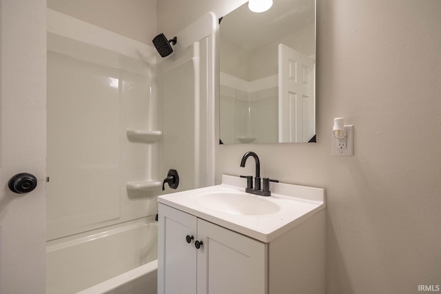 bathroom with vanity and shower / washtub combination