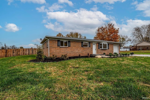 ranch-style home with a front lawn