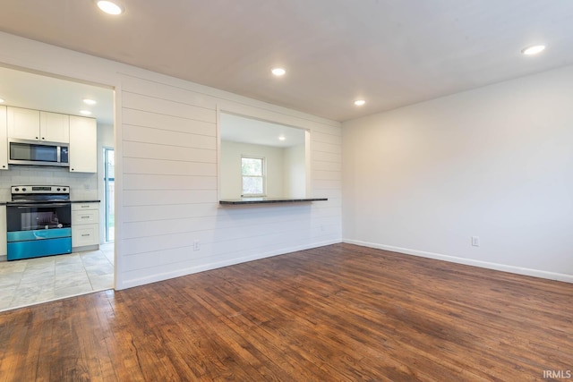 unfurnished living room featuring light hardwood / wood-style floors