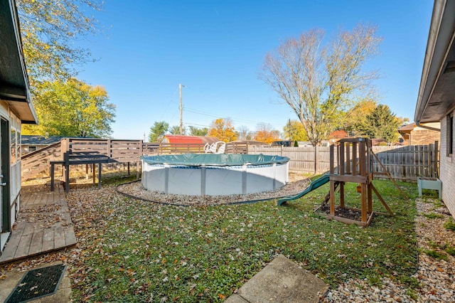 view of yard featuring a covered pool