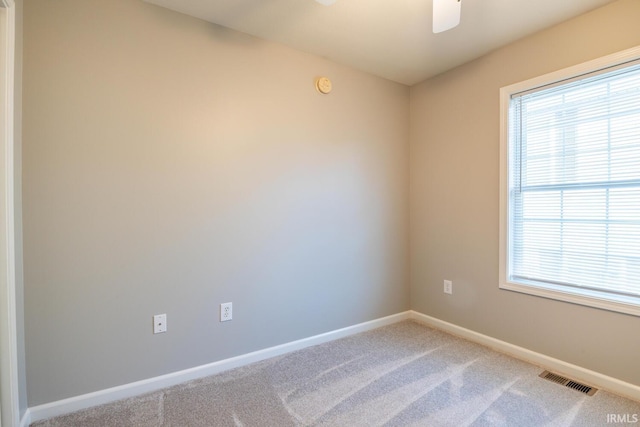 unfurnished room featuring carpet