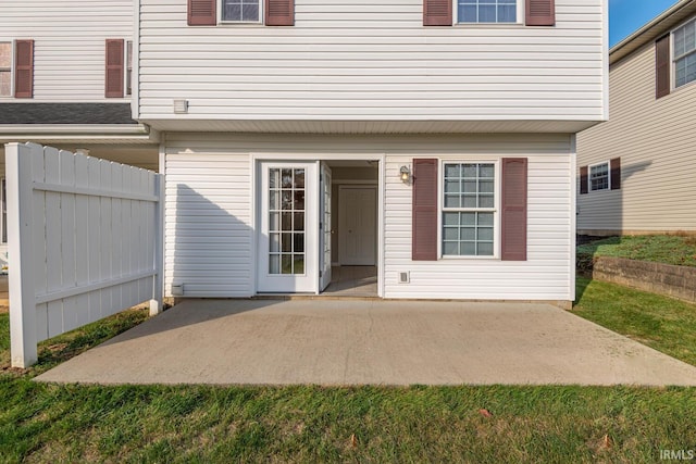 entrance to property featuring a patio