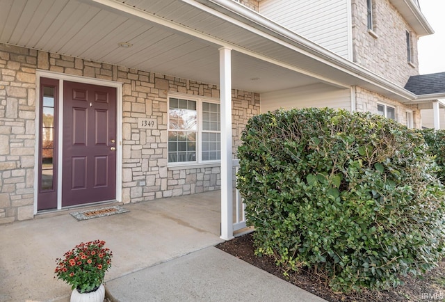 doorway to property with a porch