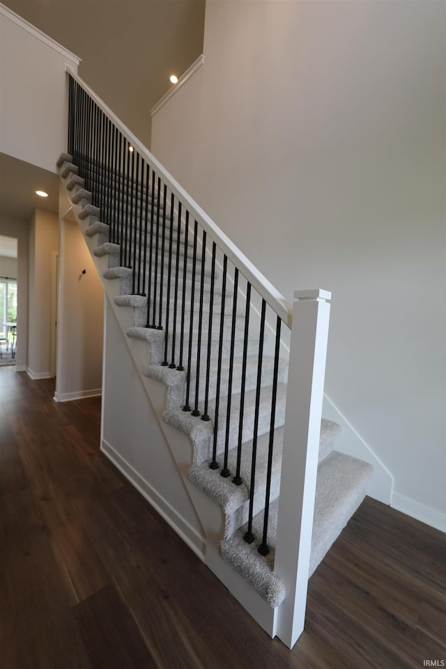 staircase featuring hardwood / wood-style flooring