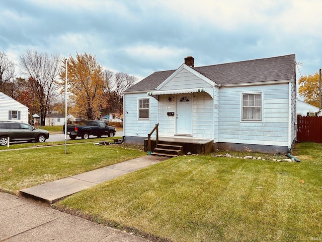 bungalow with a front yard