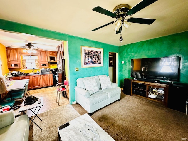 living room with light carpet and ceiling fan