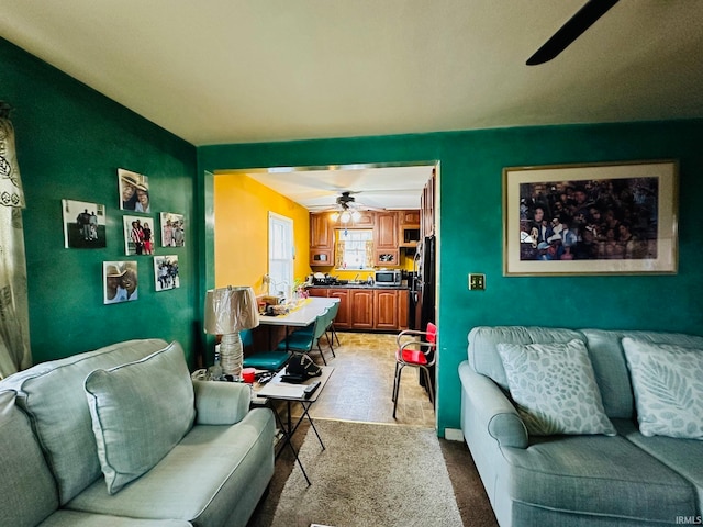 living room with carpet and ceiling fan