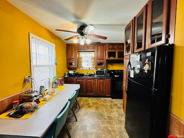 kitchen featuring ceiling fan, extractor fan, and black appliances