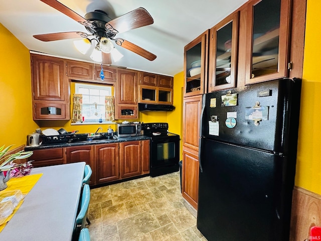 kitchen with ceiling fan, extractor fan, black appliances, and sink