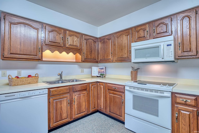 kitchen with white appliances and sink