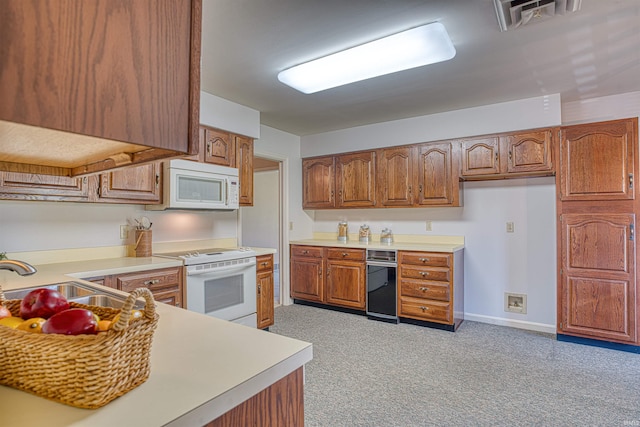 kitchen featuring white appliances and sink