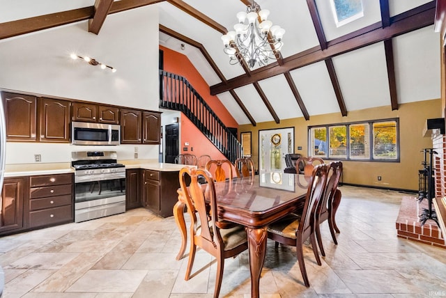 dining room featuring beam ceiling, a chandelier, and high vaulted ceiling