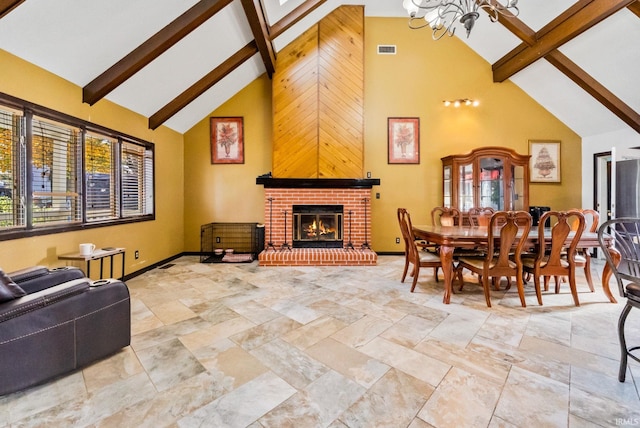 dining area with high vaulted ceiling, a fireplace, and a wealth of natural light