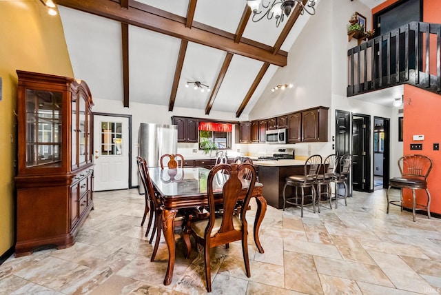 dining room with beam ceiling, high vaulted ceiling, and a chandelier