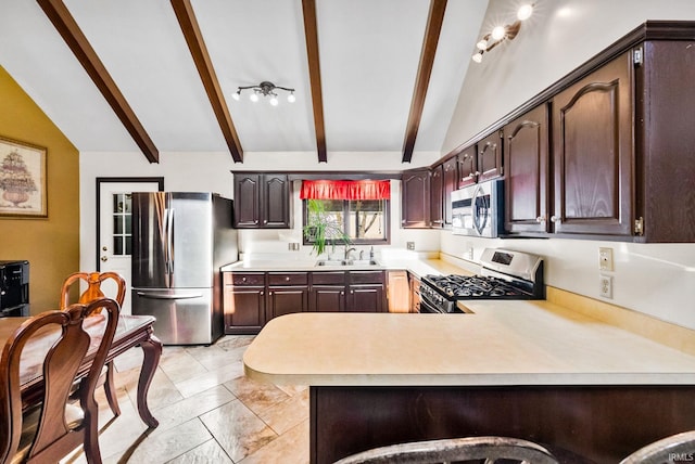 kitchen with appliances with stainless steel finishes, sink, lofted ceiling with beams, kitchen peninsula, and a breakfast bar area