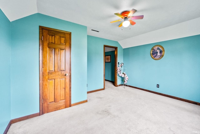 carpeted bedroom featuring ceiling fan and vaulted ceiling