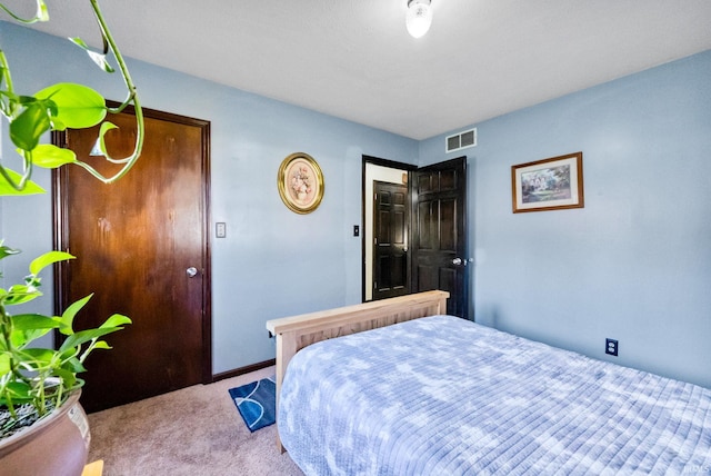 bedroom featuring light carpet