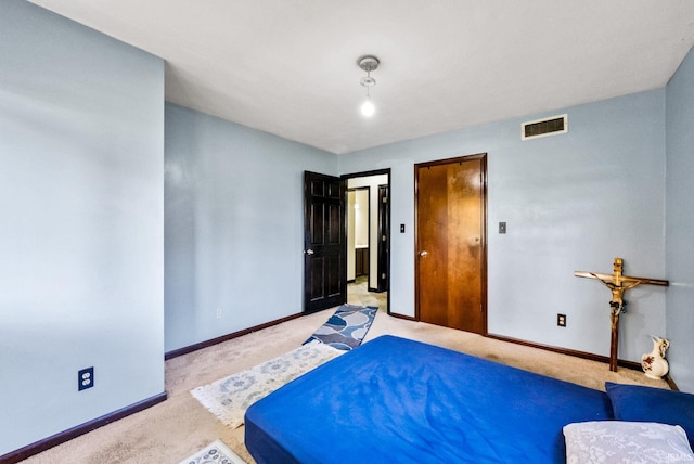 bedroom featuring light carpet