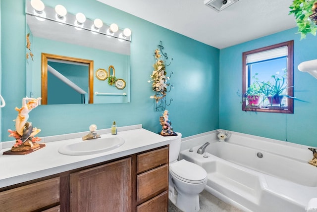 bathroom with vanity, toilet, and a bathtub